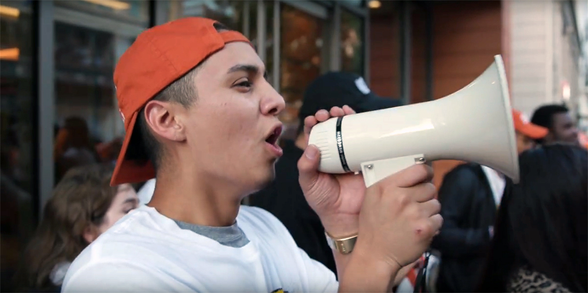 Protester using megaphone at JUUL rally